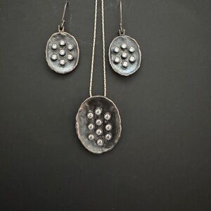 Matching earrings and pendant. Charcoal grey disks with sparkle.